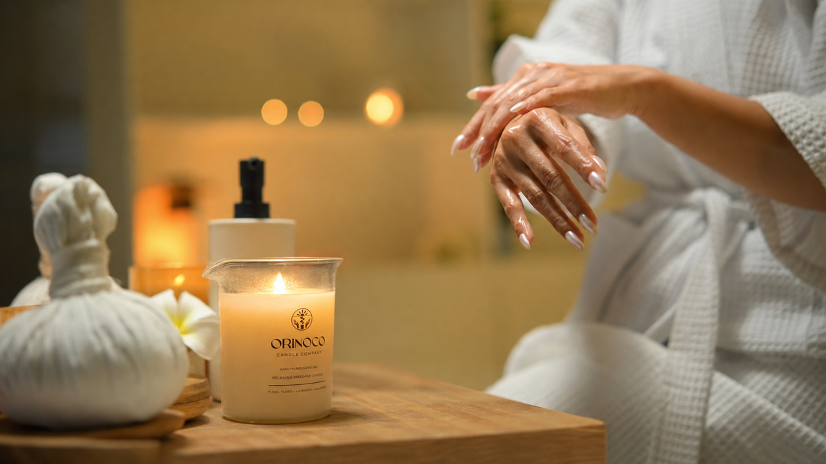 hand holding a ceramic bowl of creamy body balm with gentle steam rising