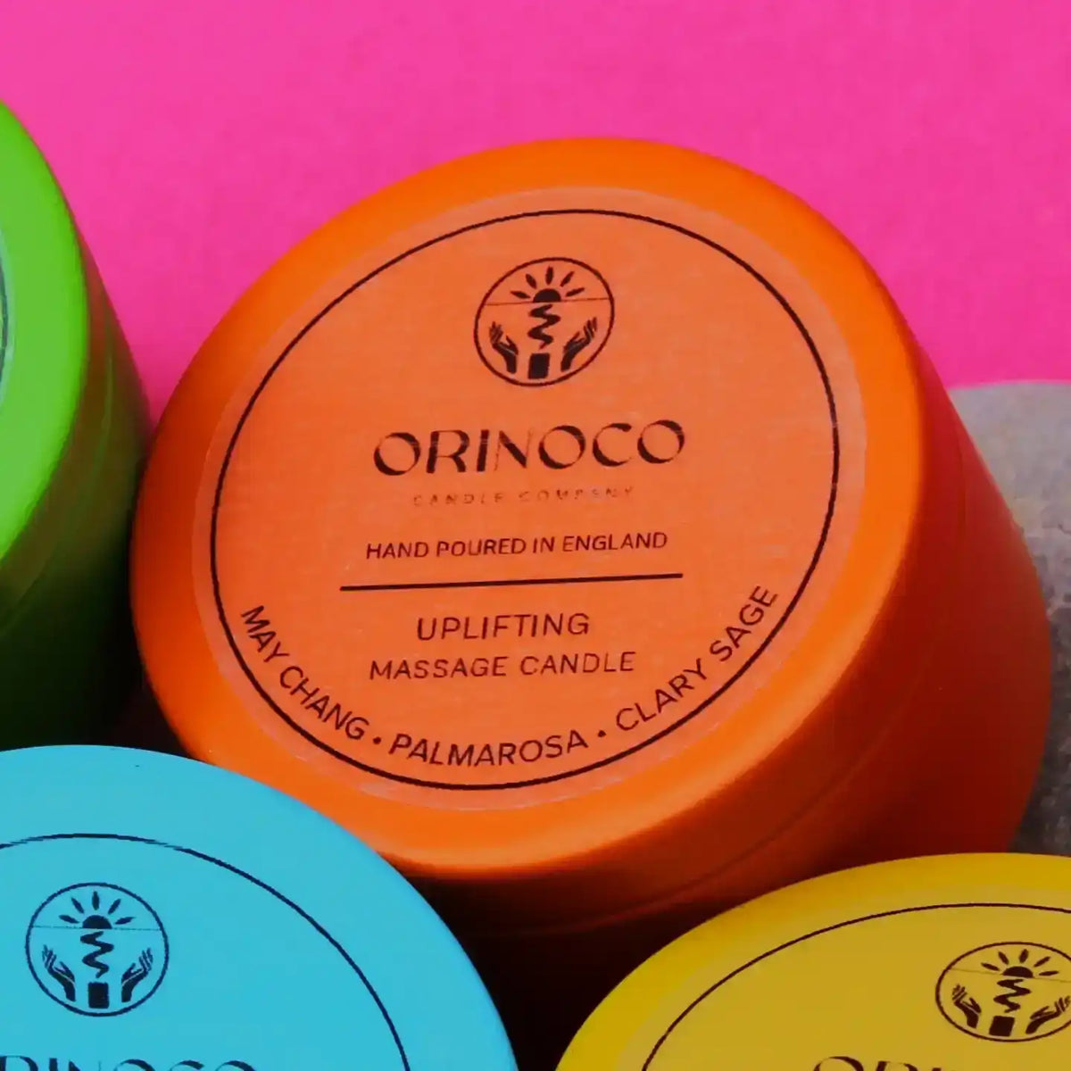 Orinoco Skincare orange Uplifting massage candle with May Chang, Palmarosa, and Clary Sage.