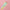 Three pastel rainbow gradient taper candles lying on a pink background