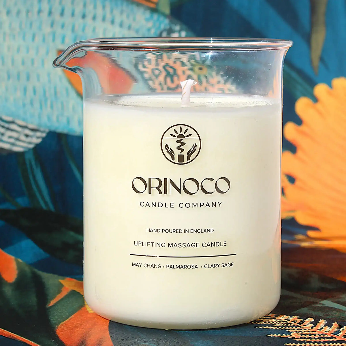 Orinoco Candle Company uplifting massage candle with May Chang, Palmarosa, and Clary Sage.