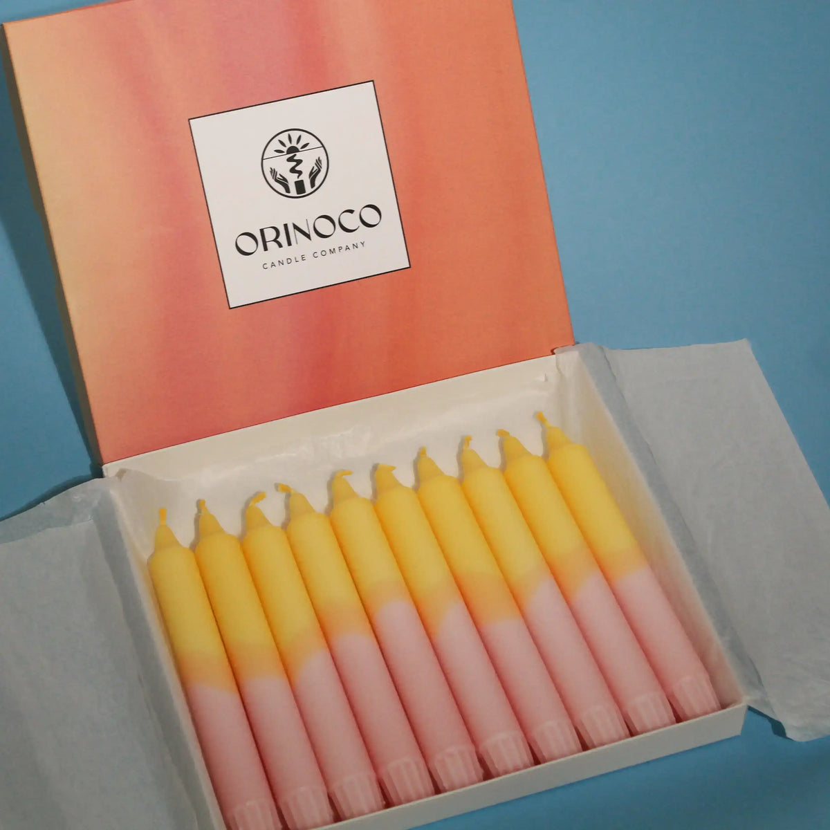 Orinoco Candle Company set of yellow and pink gradient taper candles in a white gift box