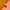 Three gradient sunset-colored taper candles on an orange and peach background.