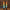 Two ombre colored taper candles in orange, yellow, green, and blue hues in black holders.