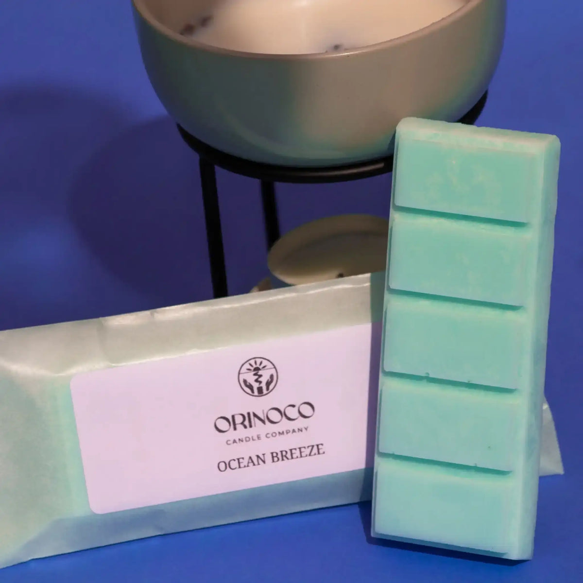 Orinoco Candle Company Ocean Breeze scented wax melts bar and packaging on blue background.