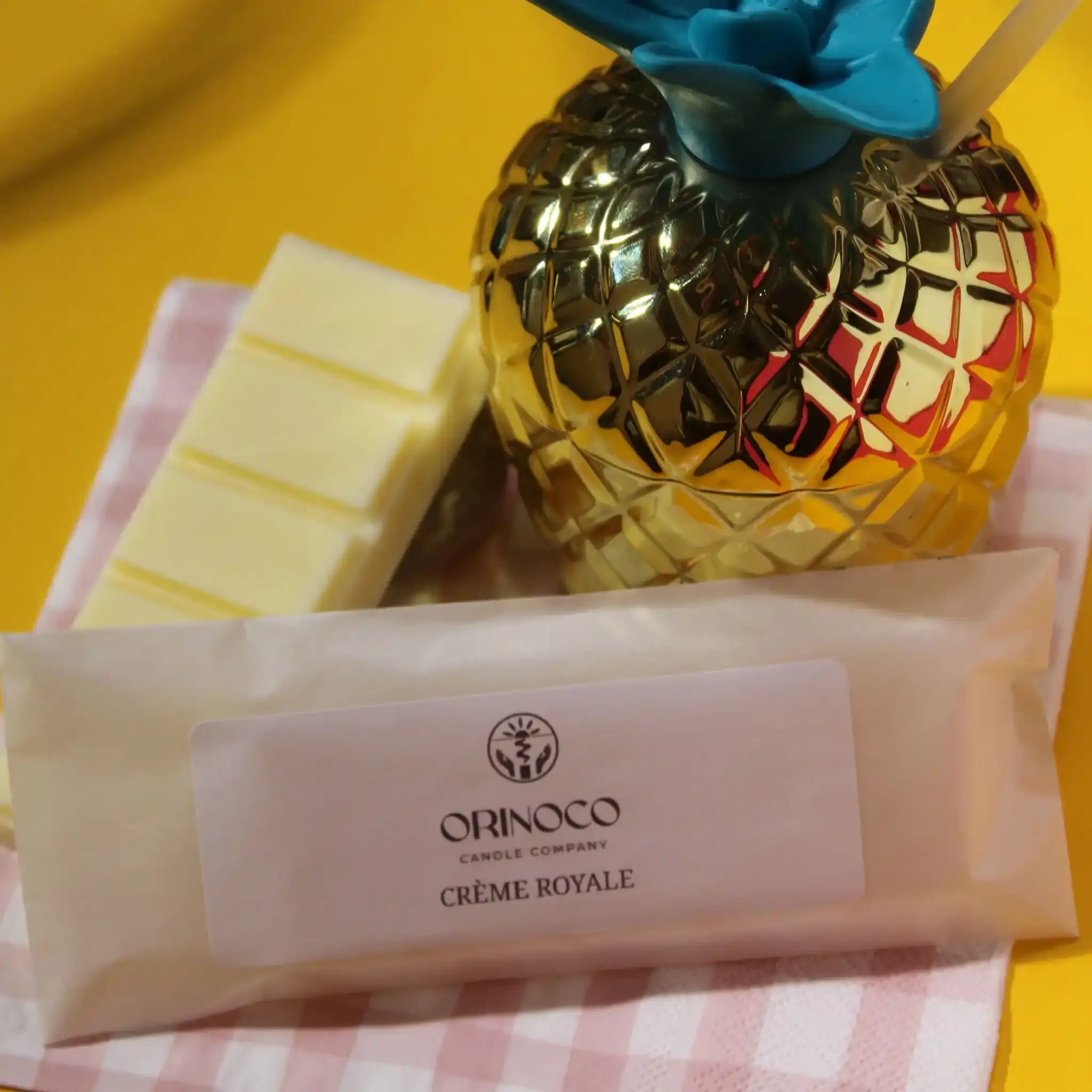 Orinoco Candle Company Crème Royale wax melts with a gold pineapple candle jar.