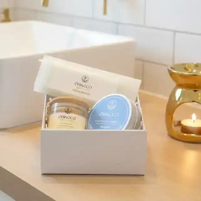 Orinoco Skincare gift set with bath products in a white box on a bathroom counter.