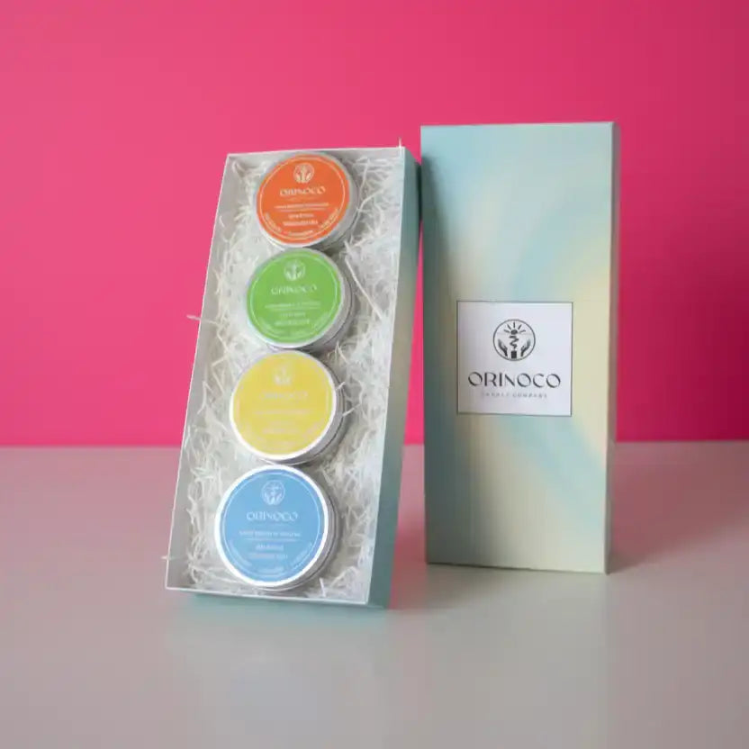 Orinoco Skincare gift set featuring four colorful natural therapeutic tins in a box.